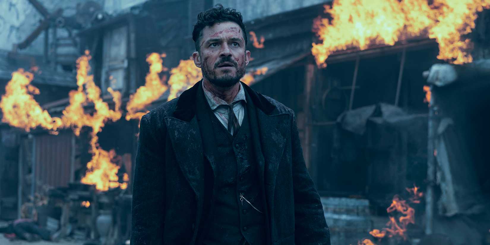 Orlando Bloom in a fire in carnival row season 2