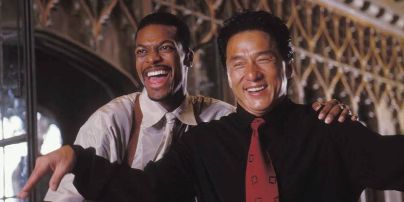 Chris Tucker as James Carter putting his arm around Jackie Chan as Lee in Rush Hour