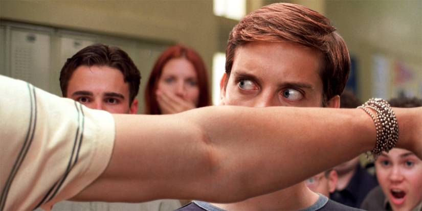Peter Parker (Tobey Maguire) dodges a punch from Flash Thompson in Spider-Man (2002)
