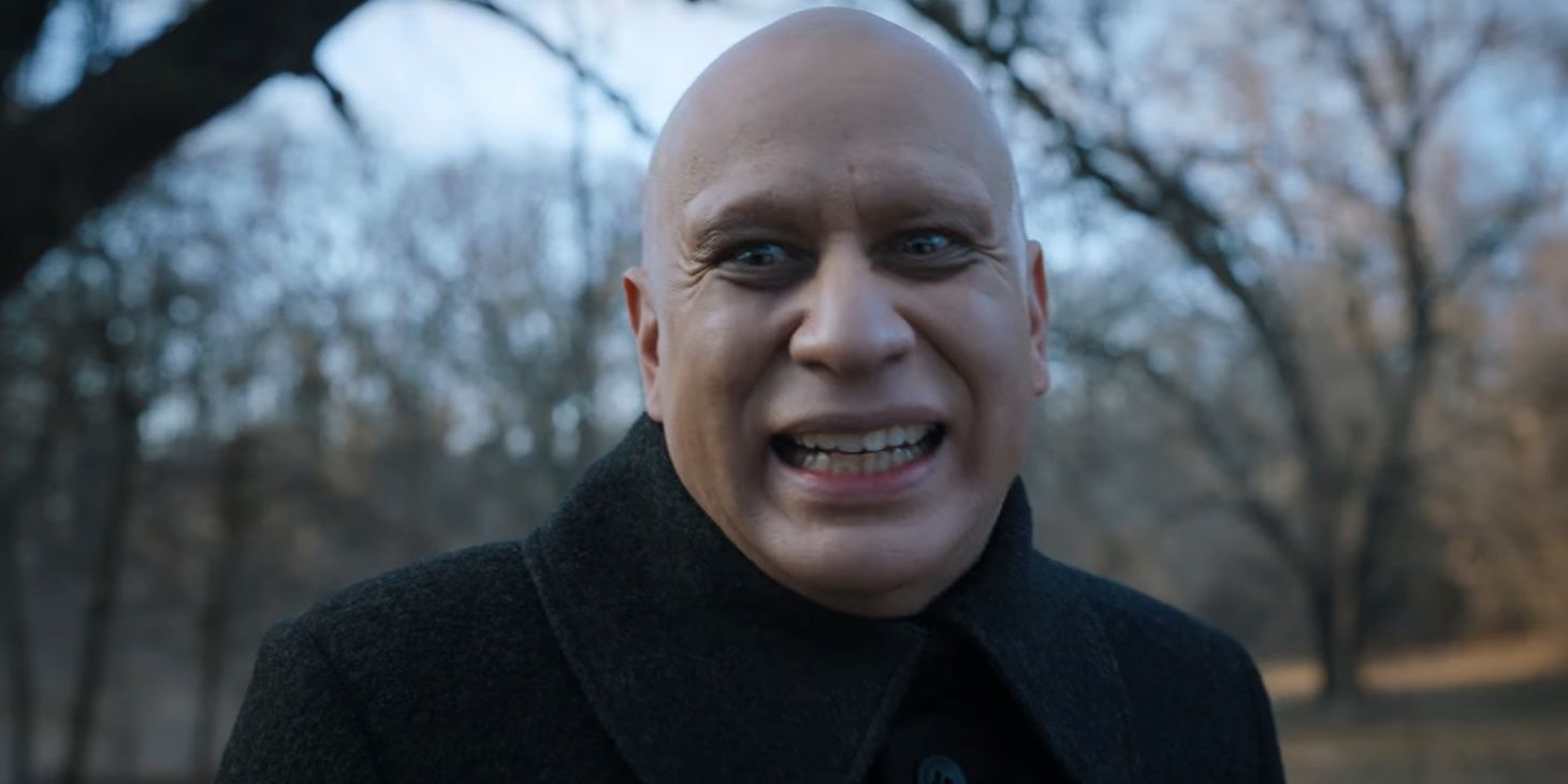 Uncle Fester smiles creepily in Wednesday season 1