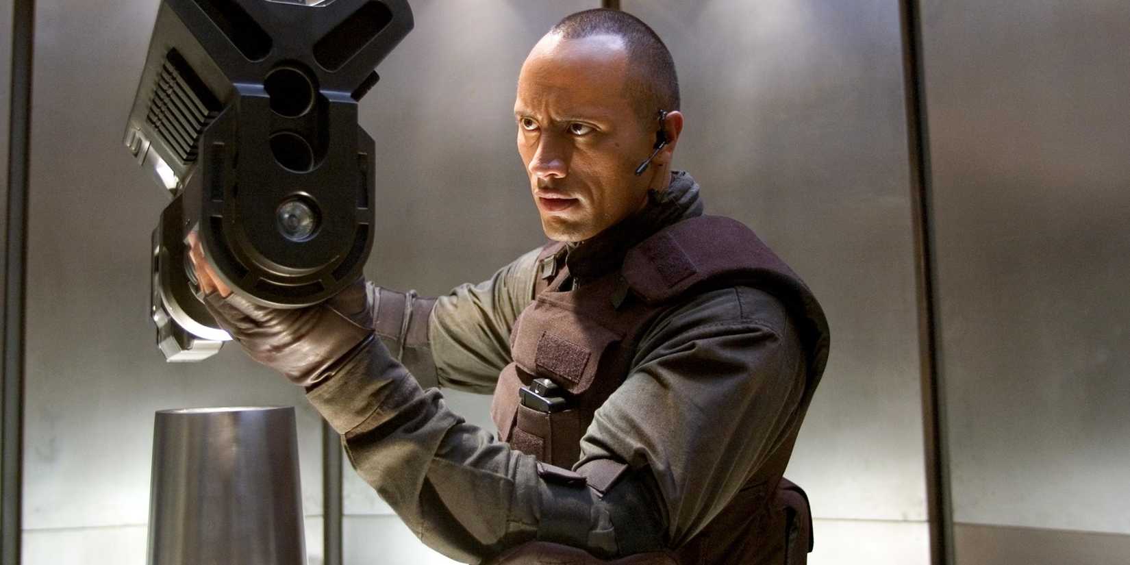 Dwayne Johnson with a big gun in Doom