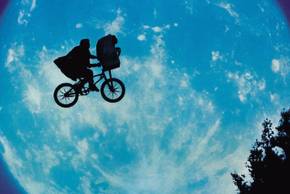Elliott and ET fly past the Moon in ET the Extra-Terrestrial