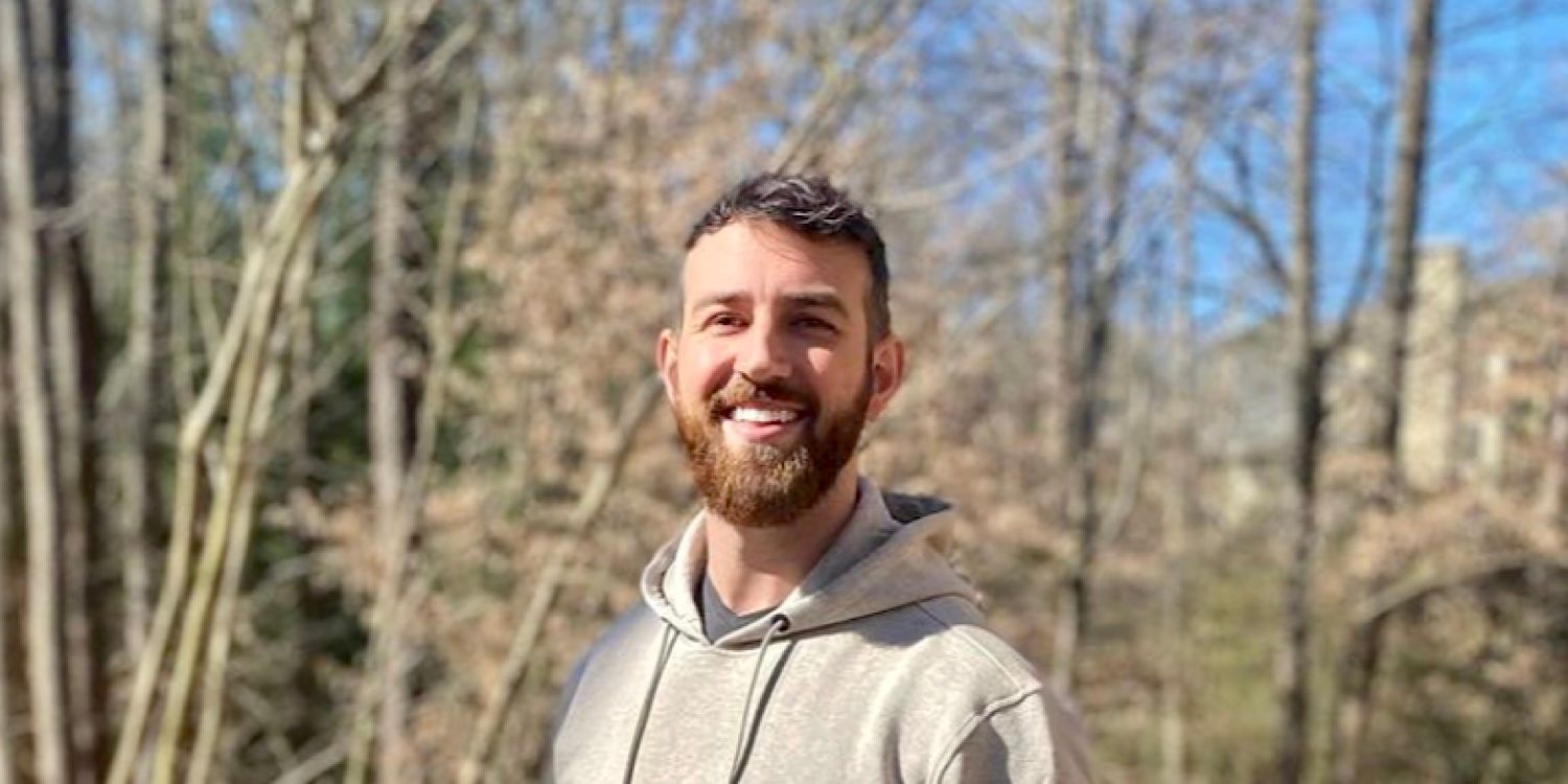 Love Is Blind’s Cameron Hamilton standing outside in front of trees