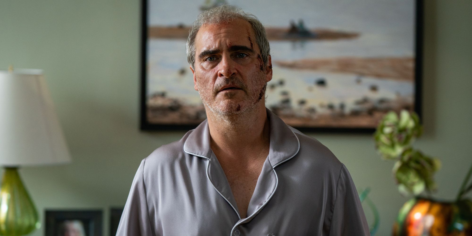 Joaquin Phoenix looking injured and sad in Beau is Afraid