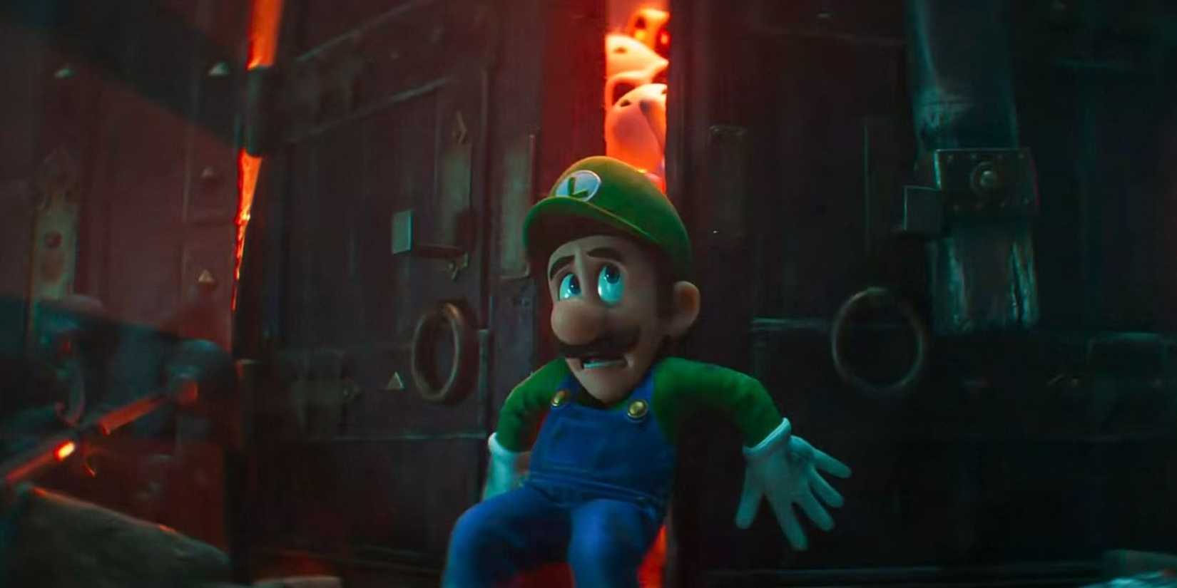 an image of Luigi trying to hold a door closed with ghosts behind it in Luigi's Mansion
