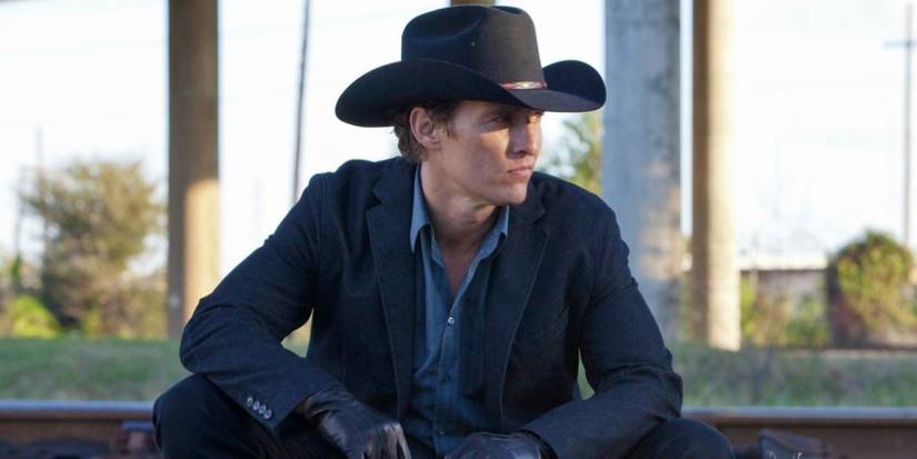 Matthew McConaughey sitting down in Killer Joe