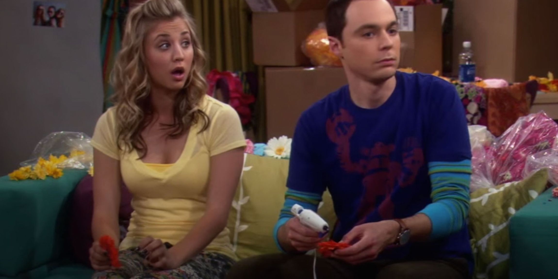 Penny and Sheldon make Penny Blossoms on her couch in The Big Bang Theory
