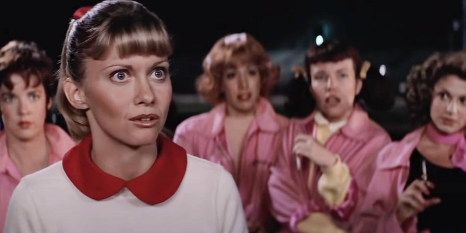 Pink Ladies and Sandy looking stunned in Grease.