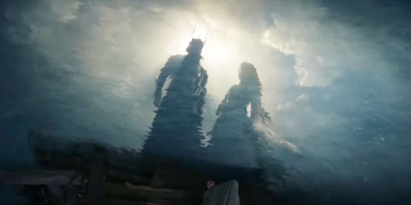 Sauron and Galadriel looking at reflections in the water of themselves as king and queen together.