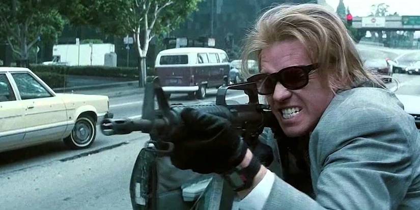 Val Kilmer as Chris firing a gun in Heat