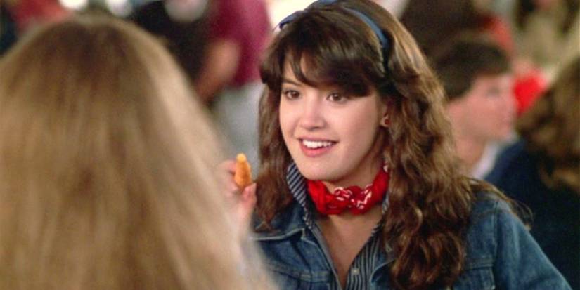 An image of Phoebe Cates sitting behind a table in Fast Times At Ridgemont High