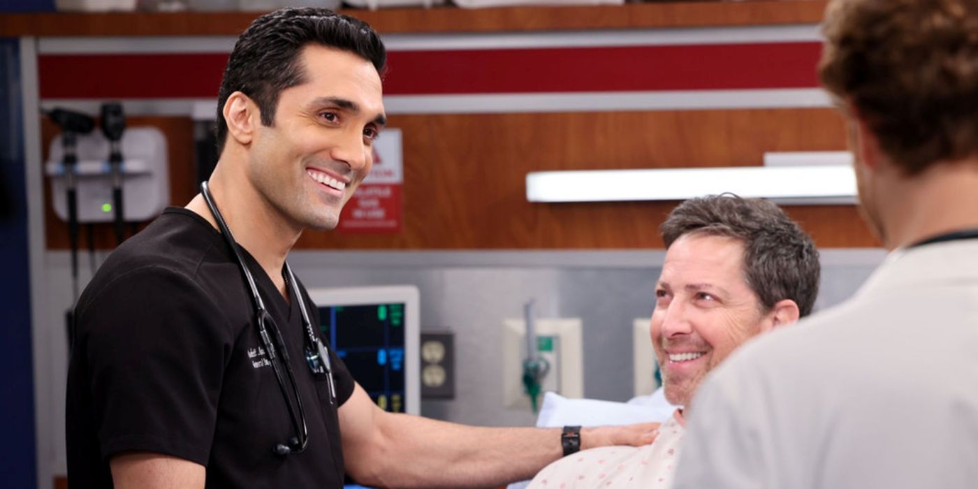 Crockett Marcel, played by Dominic Rains, wears black scrubs, and Richard Evans, played by Dan Bucatinsky, wears a hospital gown in Chicago Med season 8, episode 20.