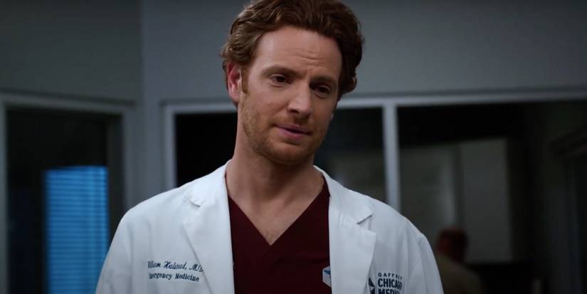Nick Gehlfuss as William Halstead with a doctor's coat on in Chicago Med season 8