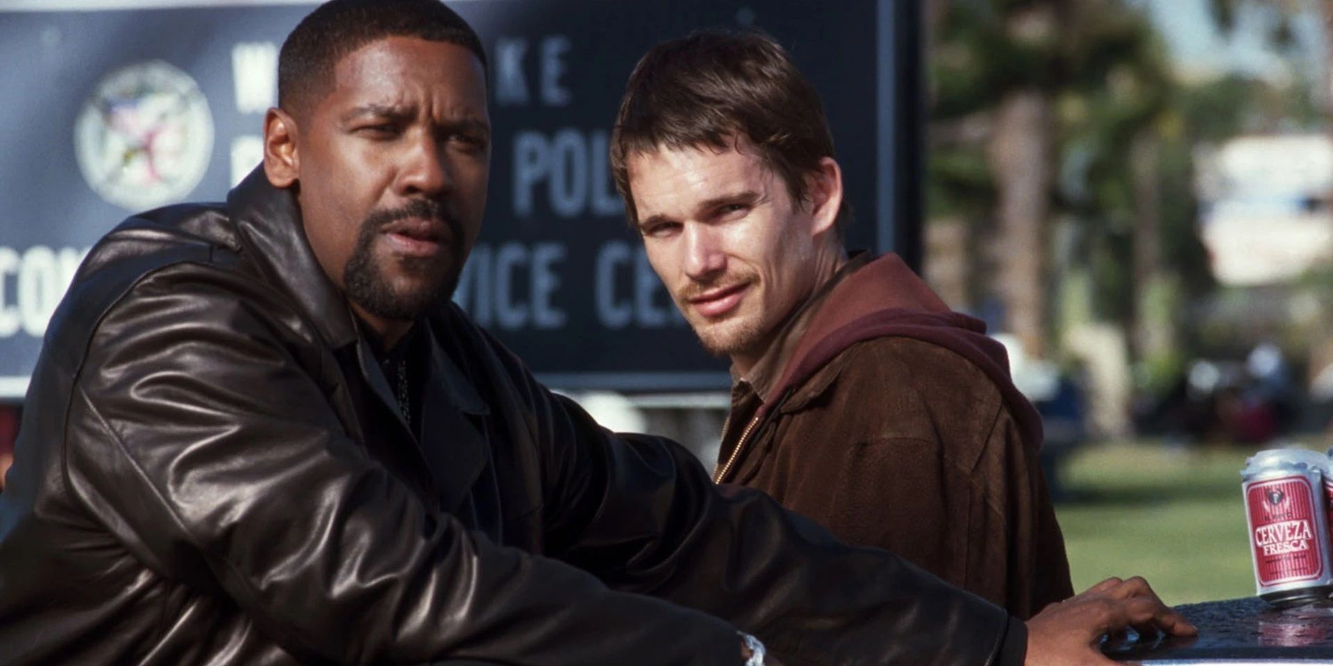 Denzel Washington and Ethan Hawke stand by the car in Training Day