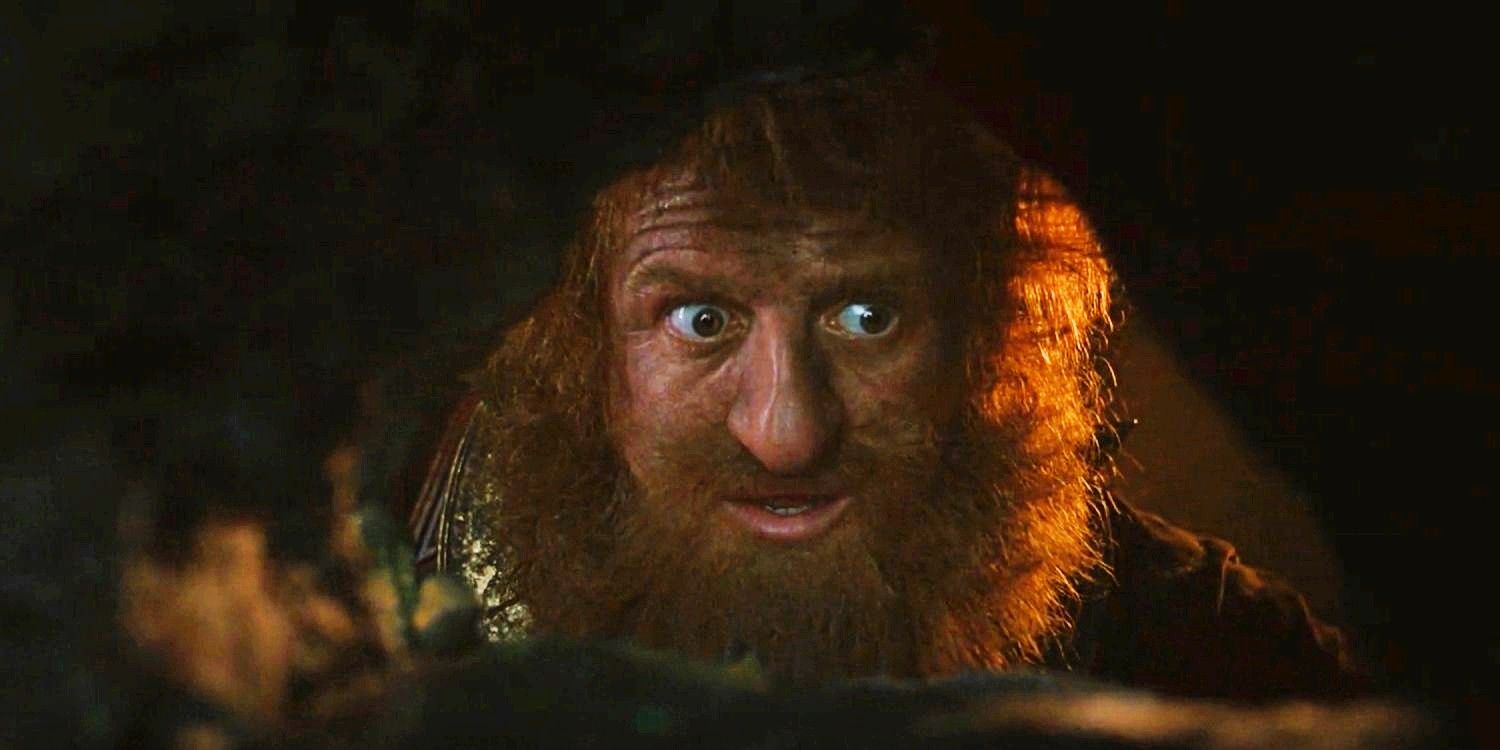 .Durin peering through a cave hole in The Lord of the Rings The Rings of Power Season 1 Episode 7