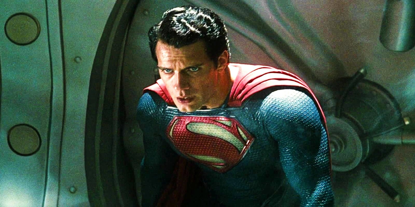 Henry Cavill As Superman Looking Tired In Front of A Bank Vault Door in Man of Steel