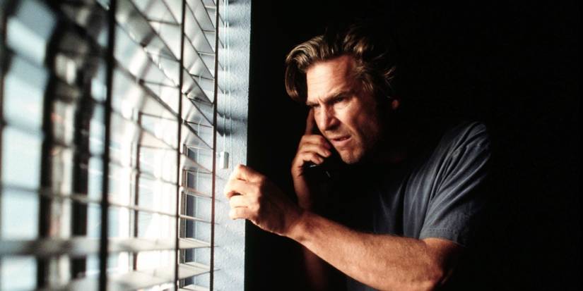 Michael Faraday (Jeff Bridges) looking out the window in Arlington Road