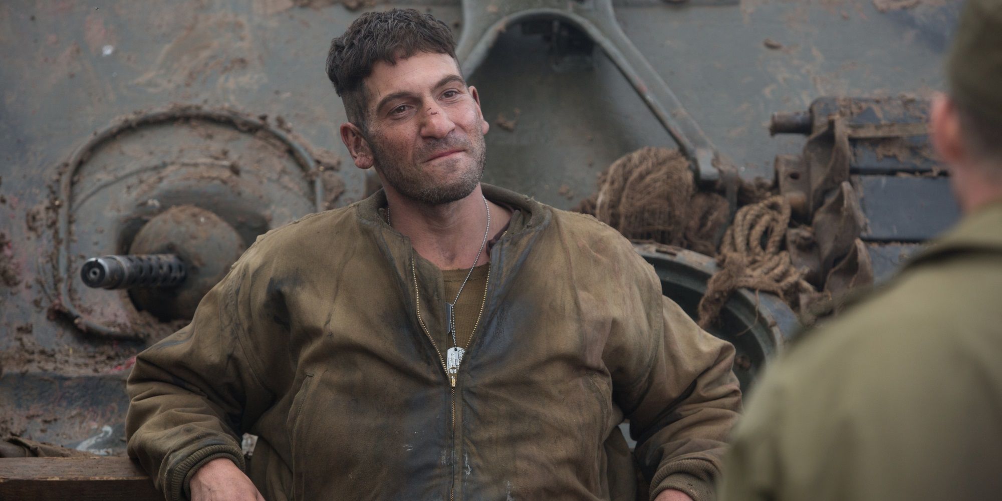 Jon Bernthal leaning on a tank in Fury.