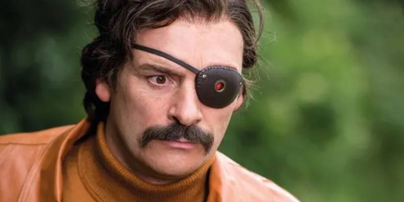 Julian Barratt looks on while wearing an eyepatch in Mindhorn
