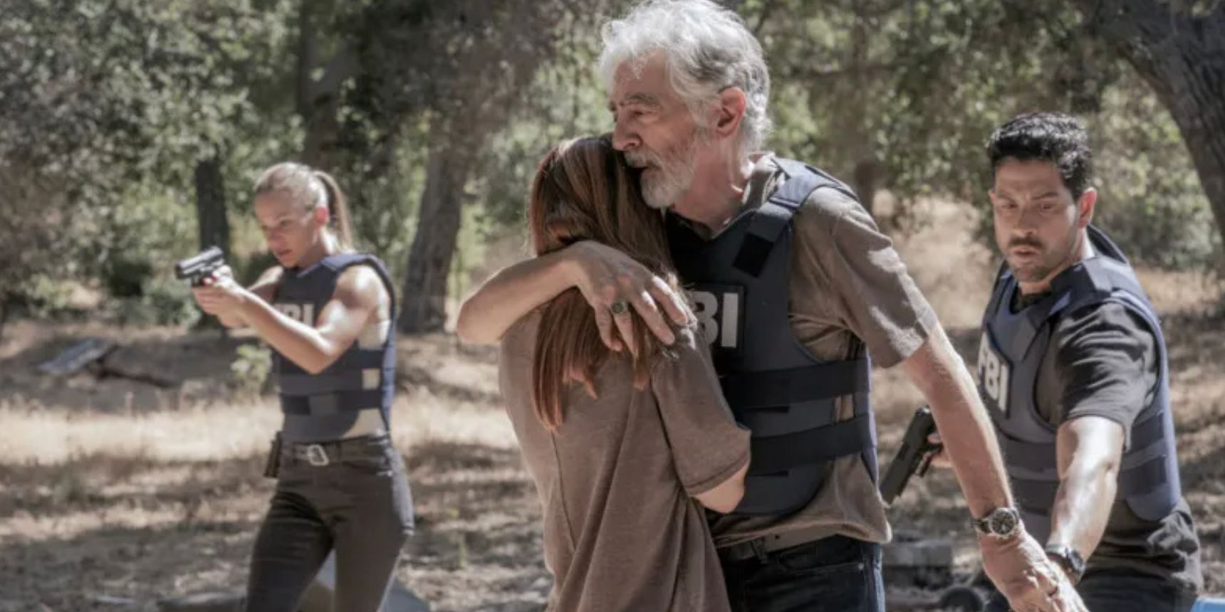 Rossi hugs an abduction survivor with team members behind him in the Criminal Minds Evolution premiere