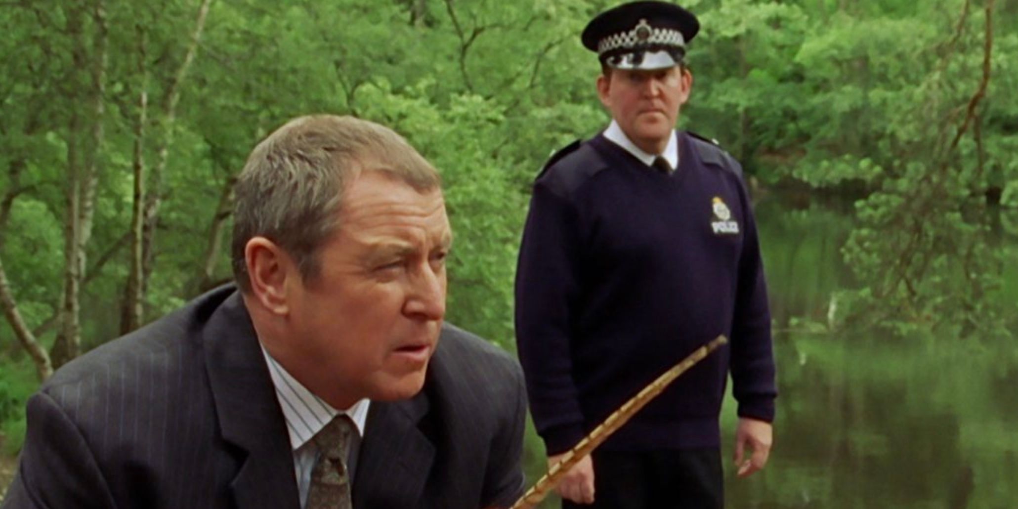 The detectives in the woods in Midsomer Murders episode Destroying Angel