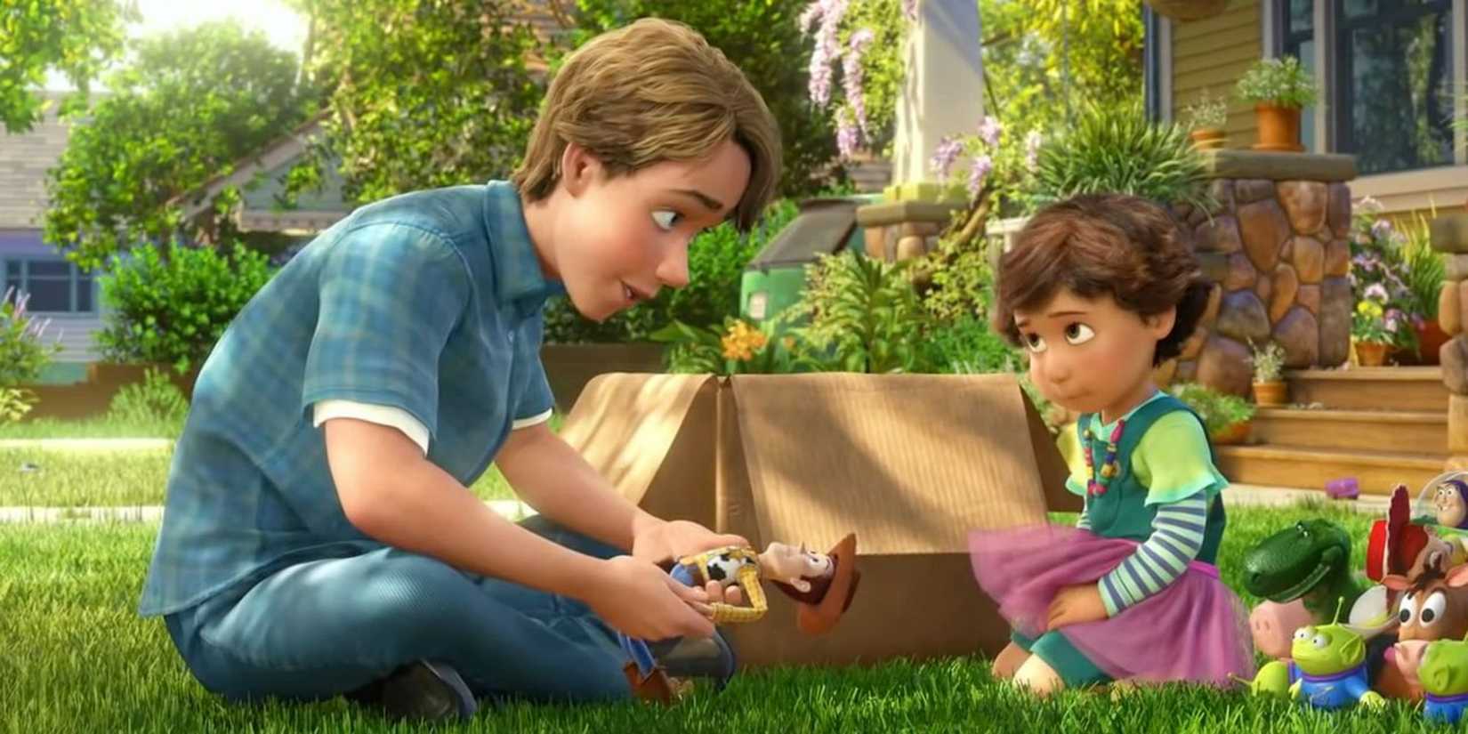 Andy holds Wood and sits on the grass with Bonnie while giving her his toys in Toy Story 3