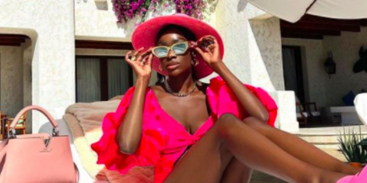 UntitChelsea Lazkani from Selling Sunset poses in a hot pink summer outfit and sunglasses