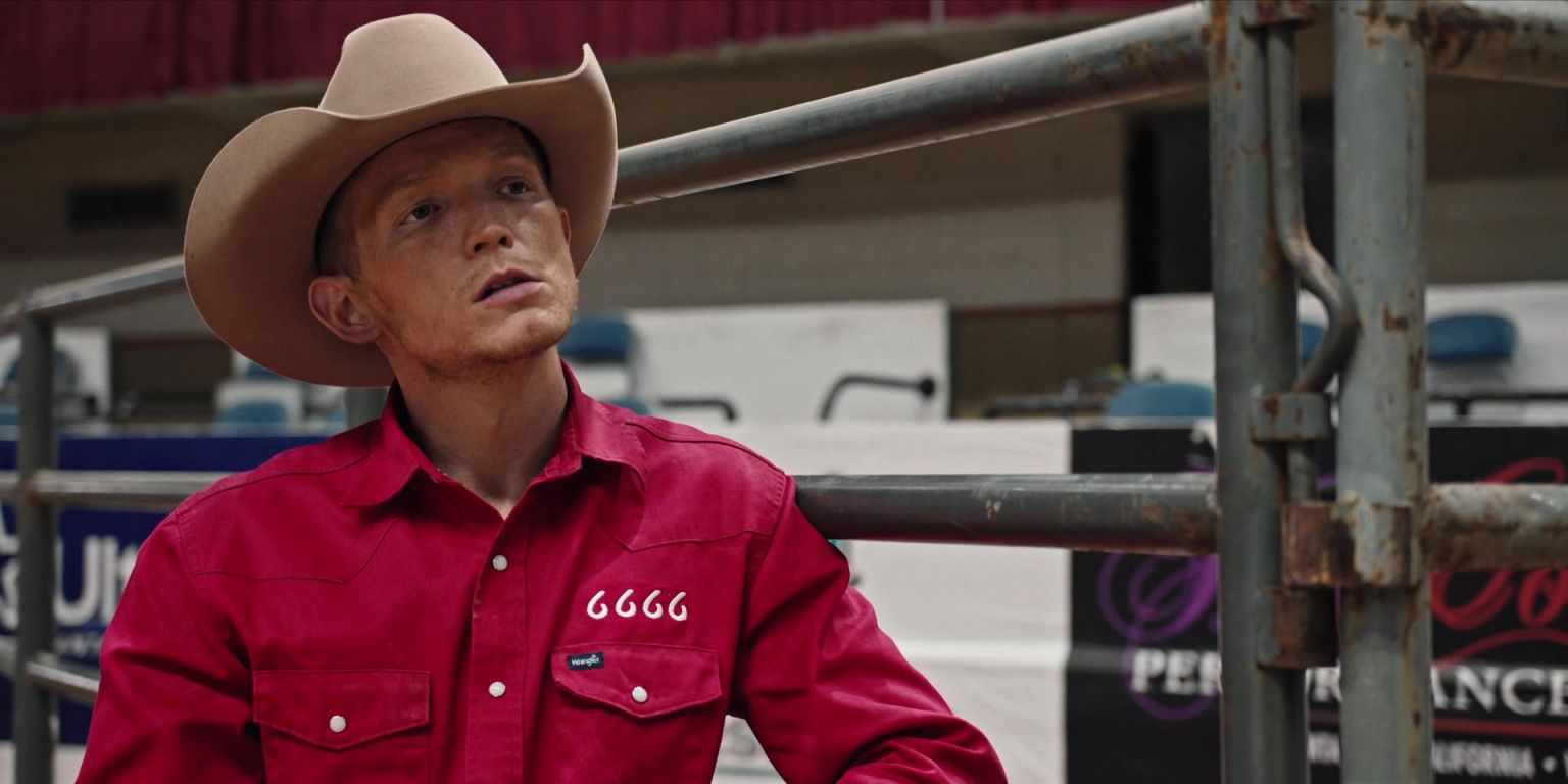 Jimmy Hurdstrom in his 6666 shirt and leaning against a fence at the rodeo in Yellowstone