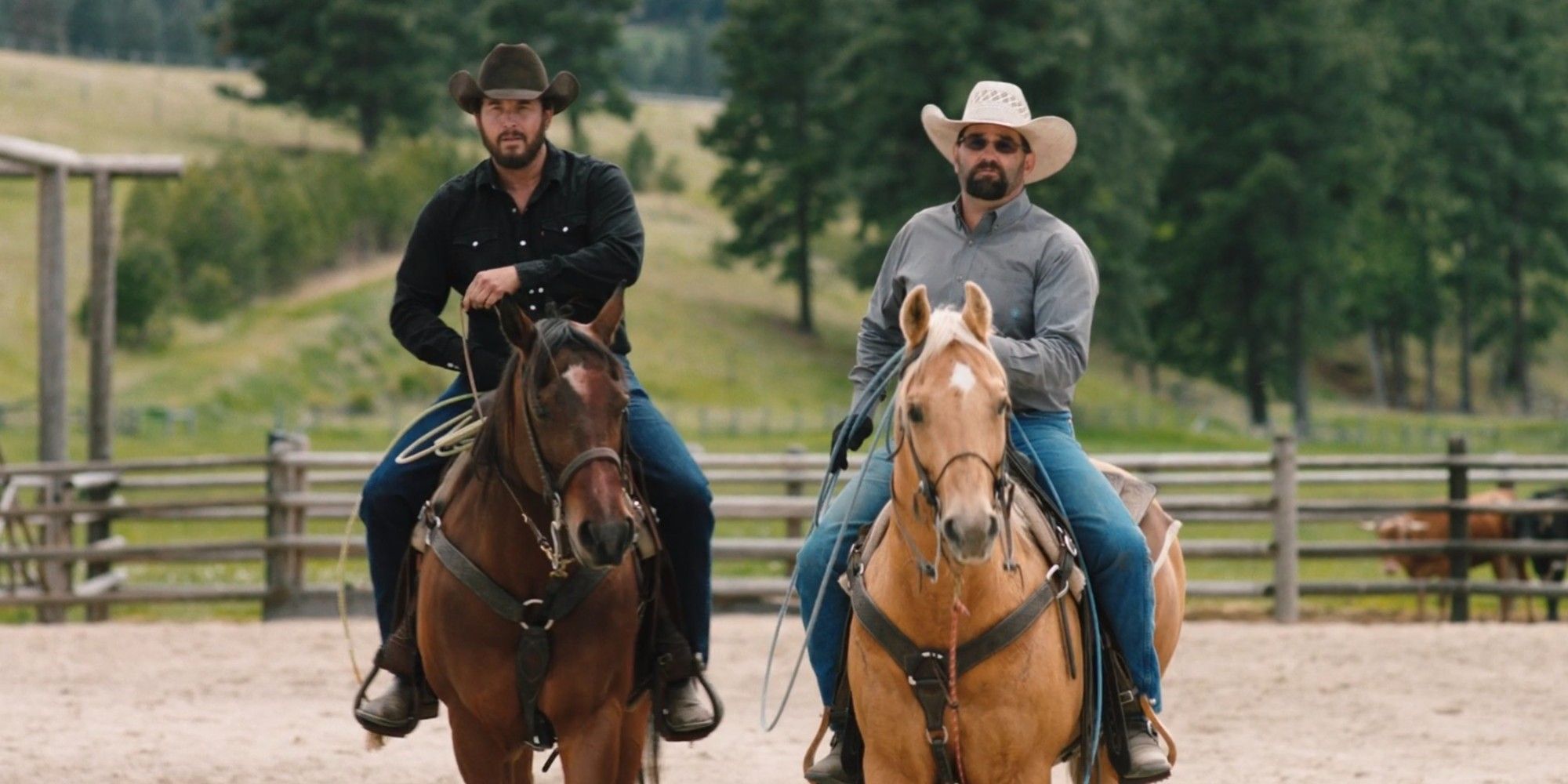 Rip and Jake advance toward the camera on horseback in Yellowstone