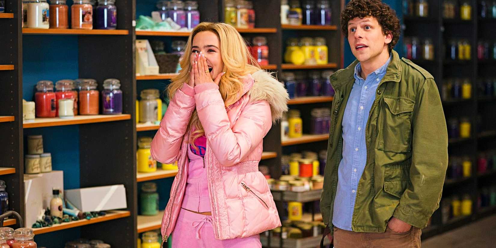 Madison (Zoey Deutch) and Columbus (Jesse Eisenberg) laughing together in Zombieland