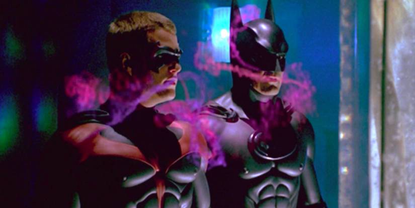 Chris O'Donnell as Robin and George Clooney as Batman breathing in Poison Ivy's love scent in Batman & Robin