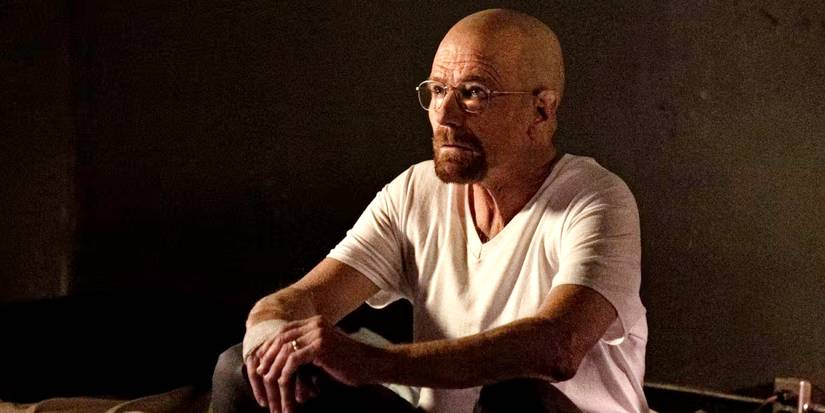 Bryan Cranston as Walter White sitting in a cell in Better Call Saul.