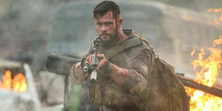 Chris Hemsworth with a gun in Extraction