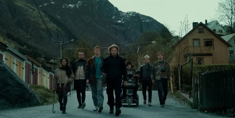 Magne and his allies walk down the street with weapons in Ragnarok