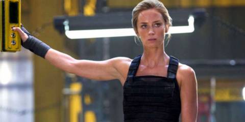 Emily Blunt as Rita stoically staring off to the side in Edge of Tomorrow