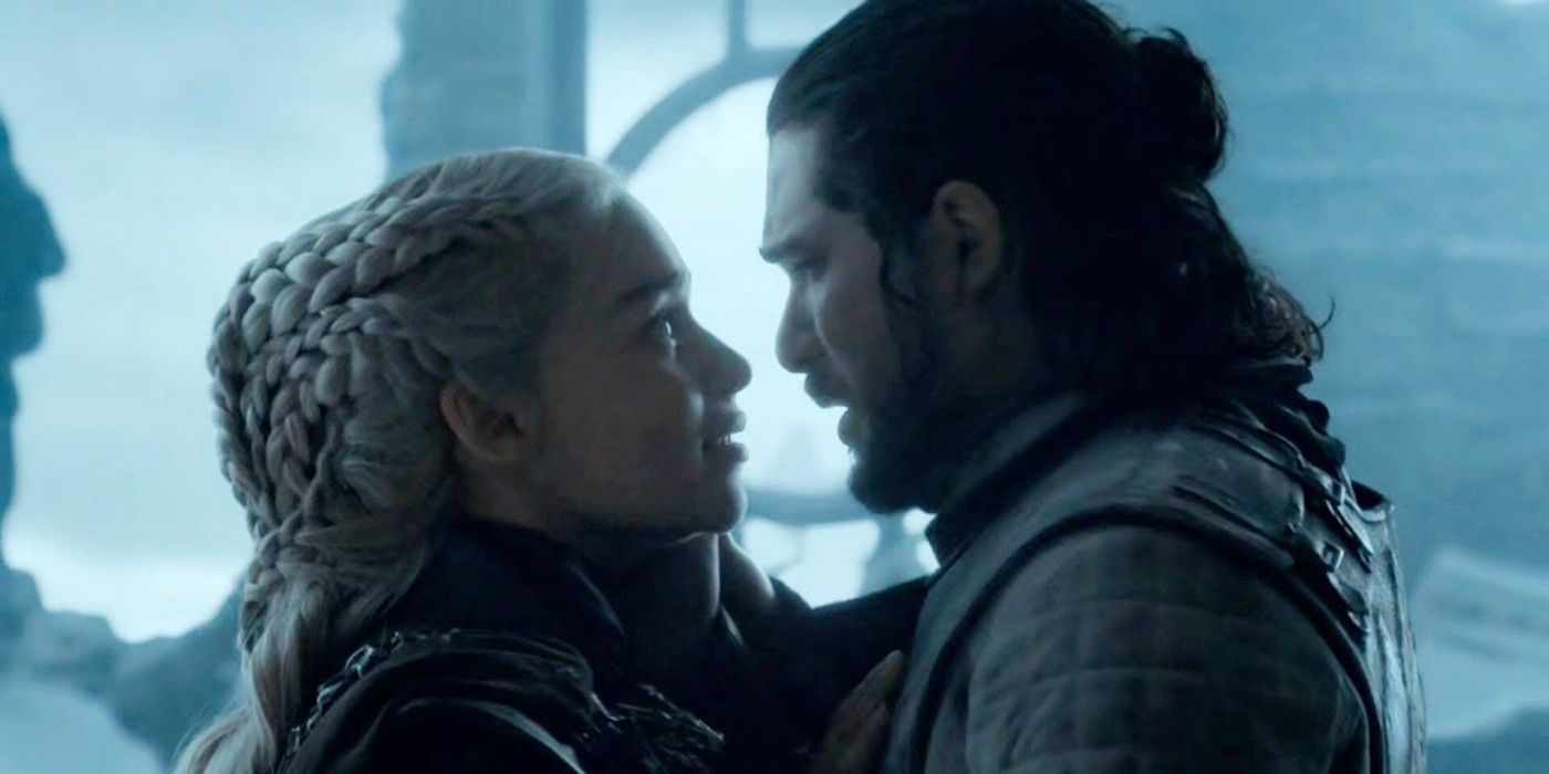 Emilia Clarke as Daenerys Targaryen and Kit Harington as Jon Snow embracing in Game of Thrones season 8