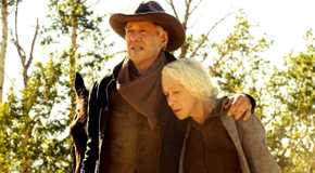 Harrison Ford holding onto Helen Mirren in 1923