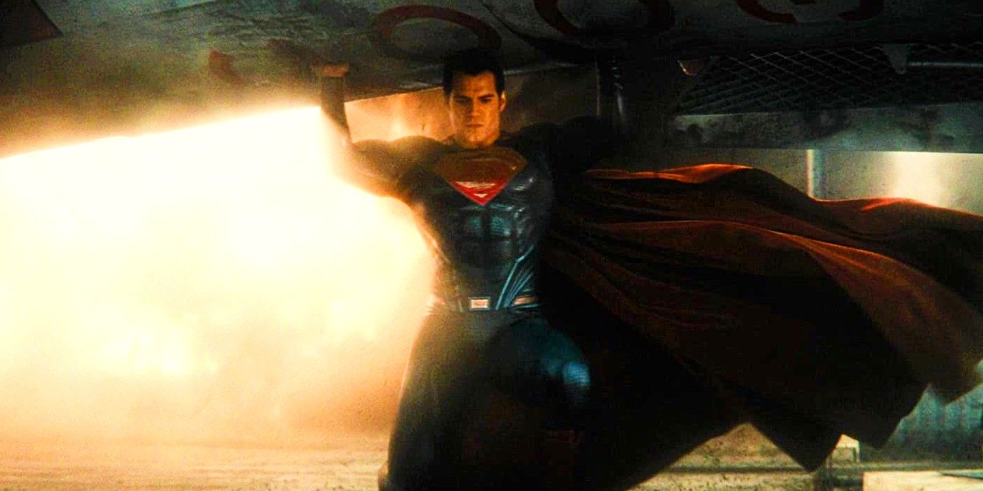 Henry Cavill's Superman holds a large piece of metal over his head in Batman V Superman Dawn of Justice