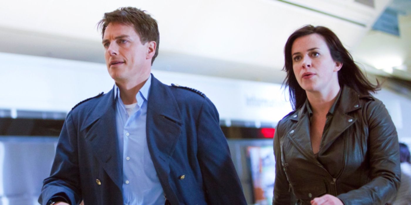 John Barrowman as Captain Jack and Eve Myles as Gwen Cooper Looking Determined in Torchwood