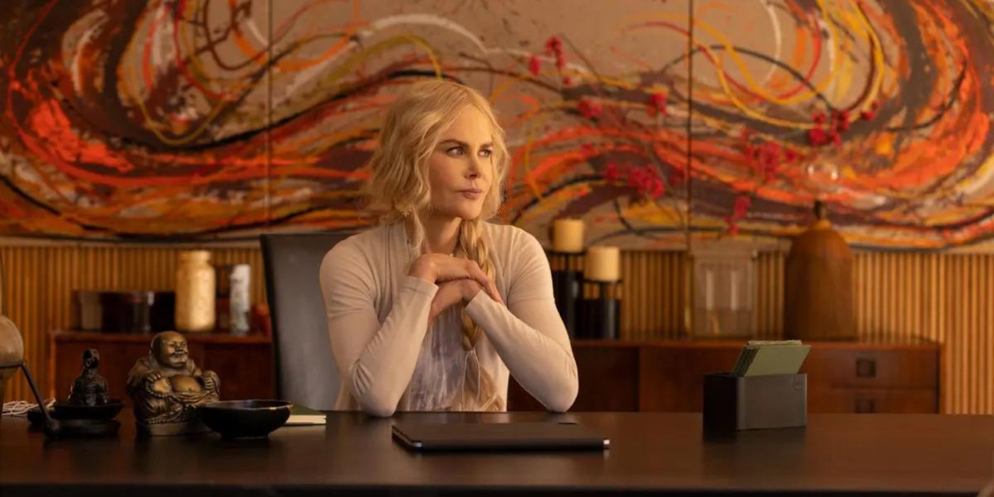 An image of Nicole Kidman sitting behind a desk in Nine Perfect Strangers