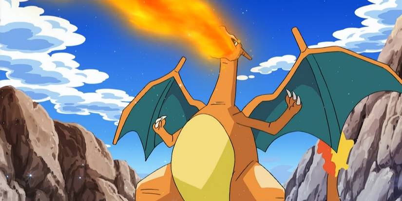 Pokemon: Ash's Charizard breathing fire in a mountainous region.