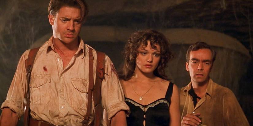Rick, Evelyn, and Jonathan looking down in the ruins in The Mummy