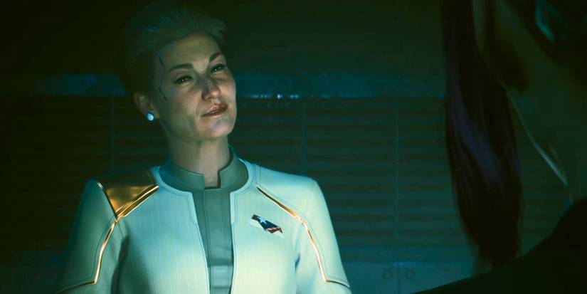 Rosalind Myers smiling at an off-screen character in Cyberpunk 2077 Phantom Liberty.