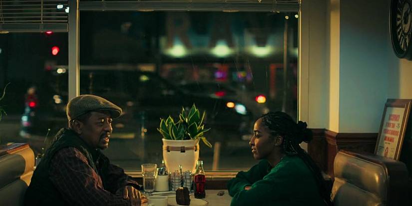 Sydney and her father in a dinner at night in The Bear