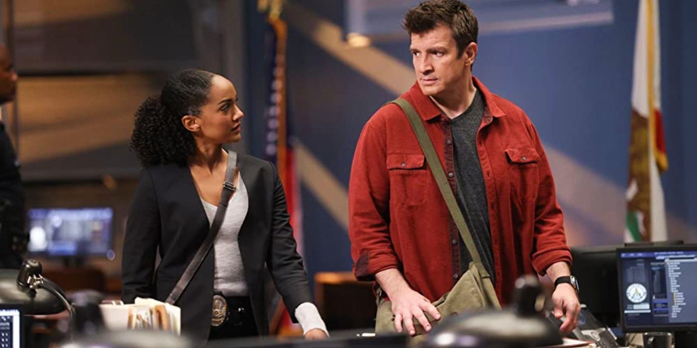 Harper (Mekia Cox) and Nolan (Nathan Fillion) talking in The Rookie