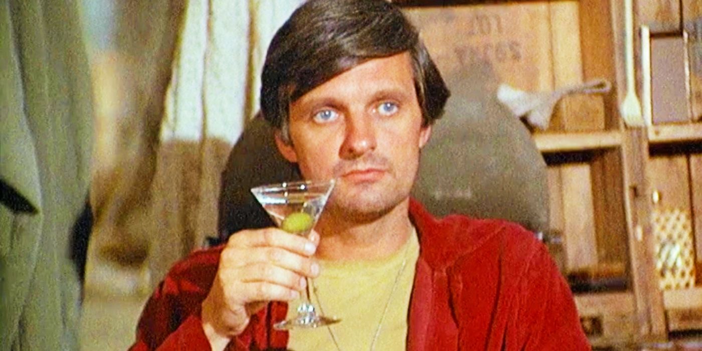 Alan Alda as Hawkeye in MASH having a drink
