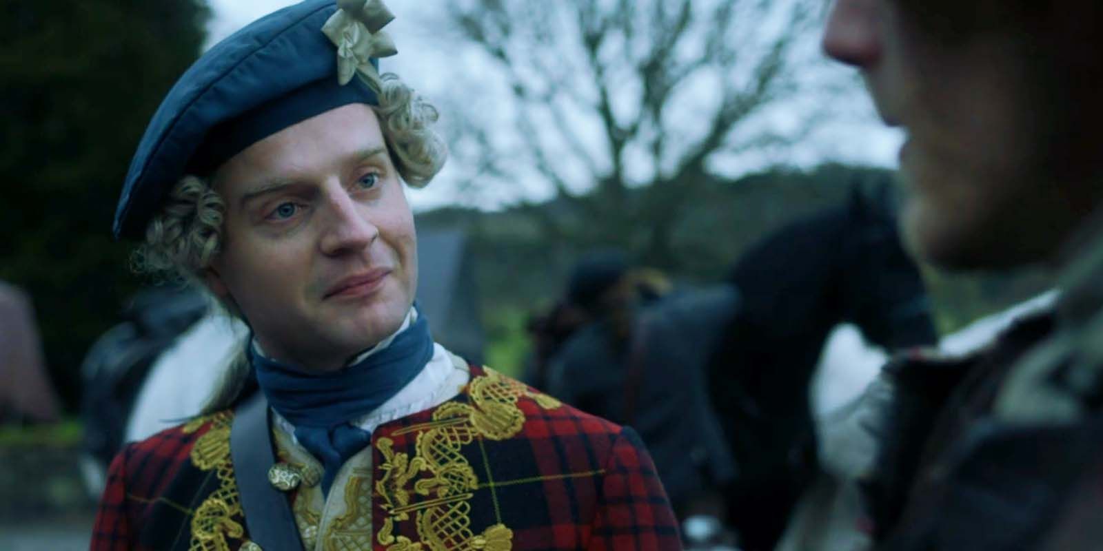 Andrew Gower as Bonnie Prince Charlie smiling at someone in Outlander season 2 finale