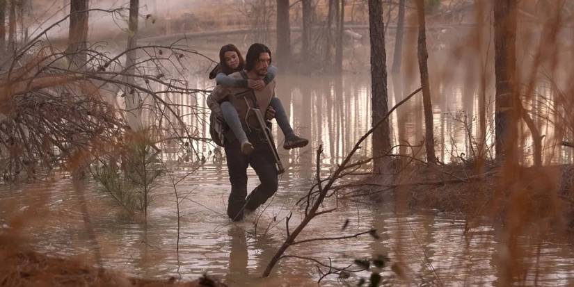 Captain Mill and Koa walk through a swamp in 65