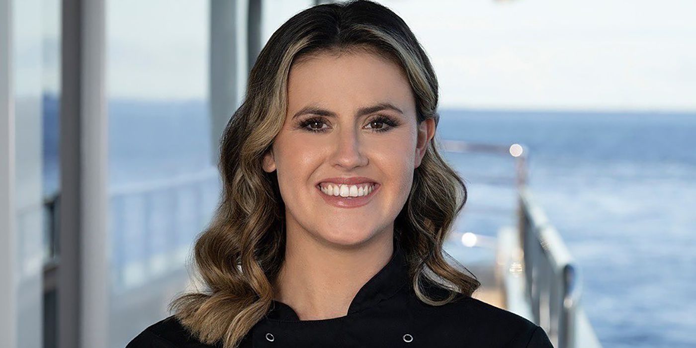 Chef Tzarina Mace-Ralph Below Deck Down Under smiling on deck blue background