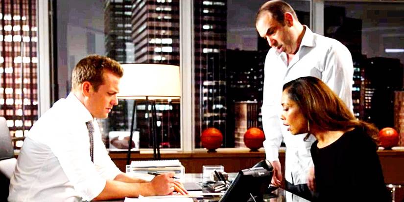 Harvey, Jessica, and Louis working in the office in Suits